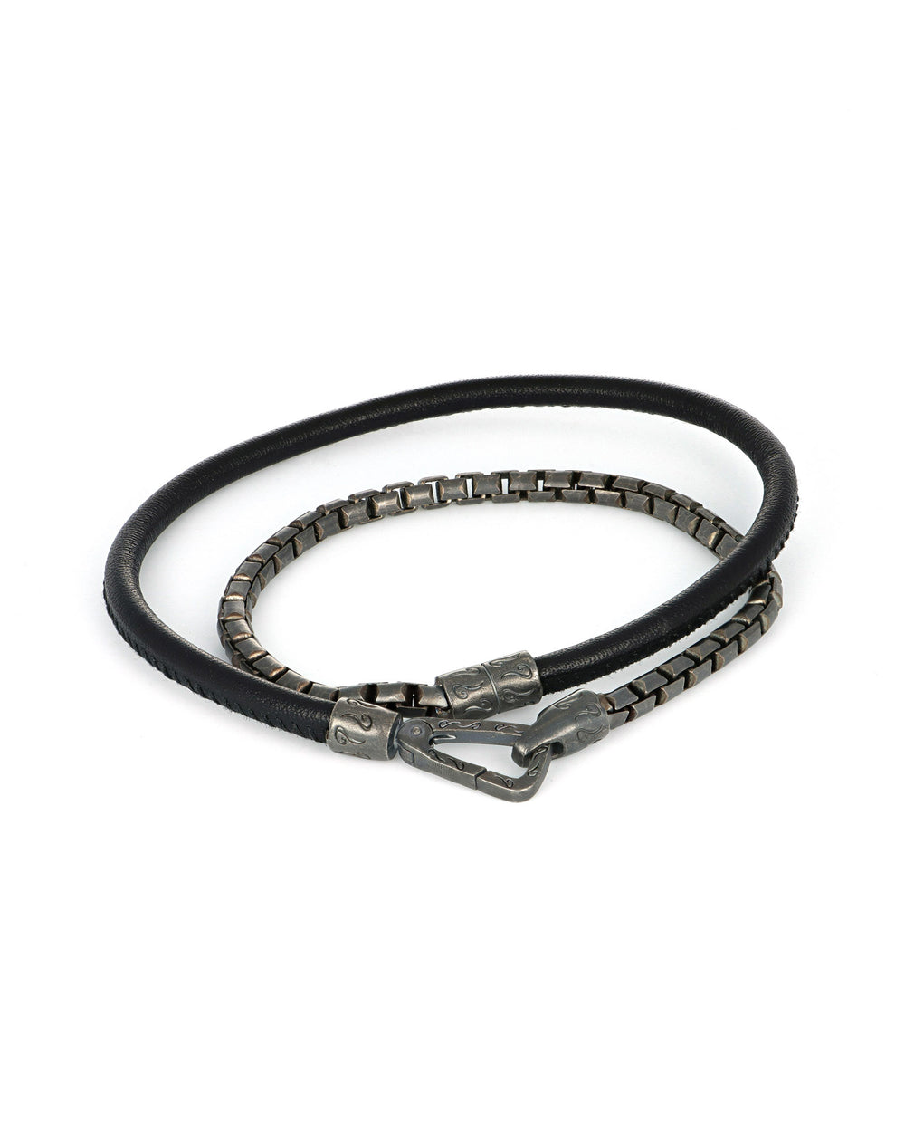 The Lash double wrap bracelet by Marco Dal Maso makes a distinctive luxury jewelry gift for men, combining oxidized silver with smooth black leather. Designed to loop twice around the wrist, with a total length of 16.5 inches to fit an 8 inch wrist. Made in Italy. Explore more luxury gifts for men, including bracelets, pendants, watches, and accessories. All items are available online or in-store at Green Lake Gallery, located in Seattle and Bellevue.