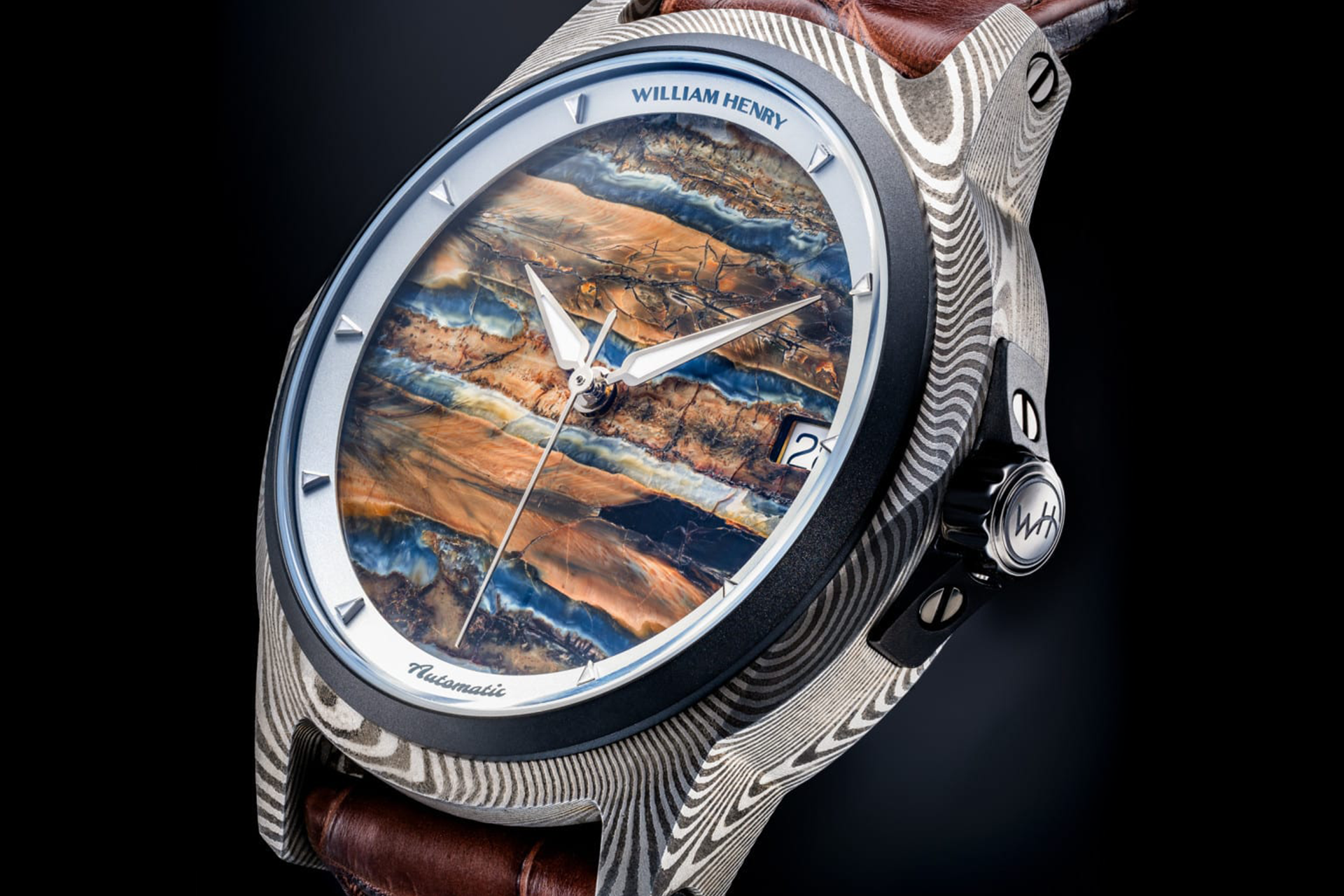 Elegant men's watch with hand made mokume-gane case and mammoth tooth fossil face by william henry 