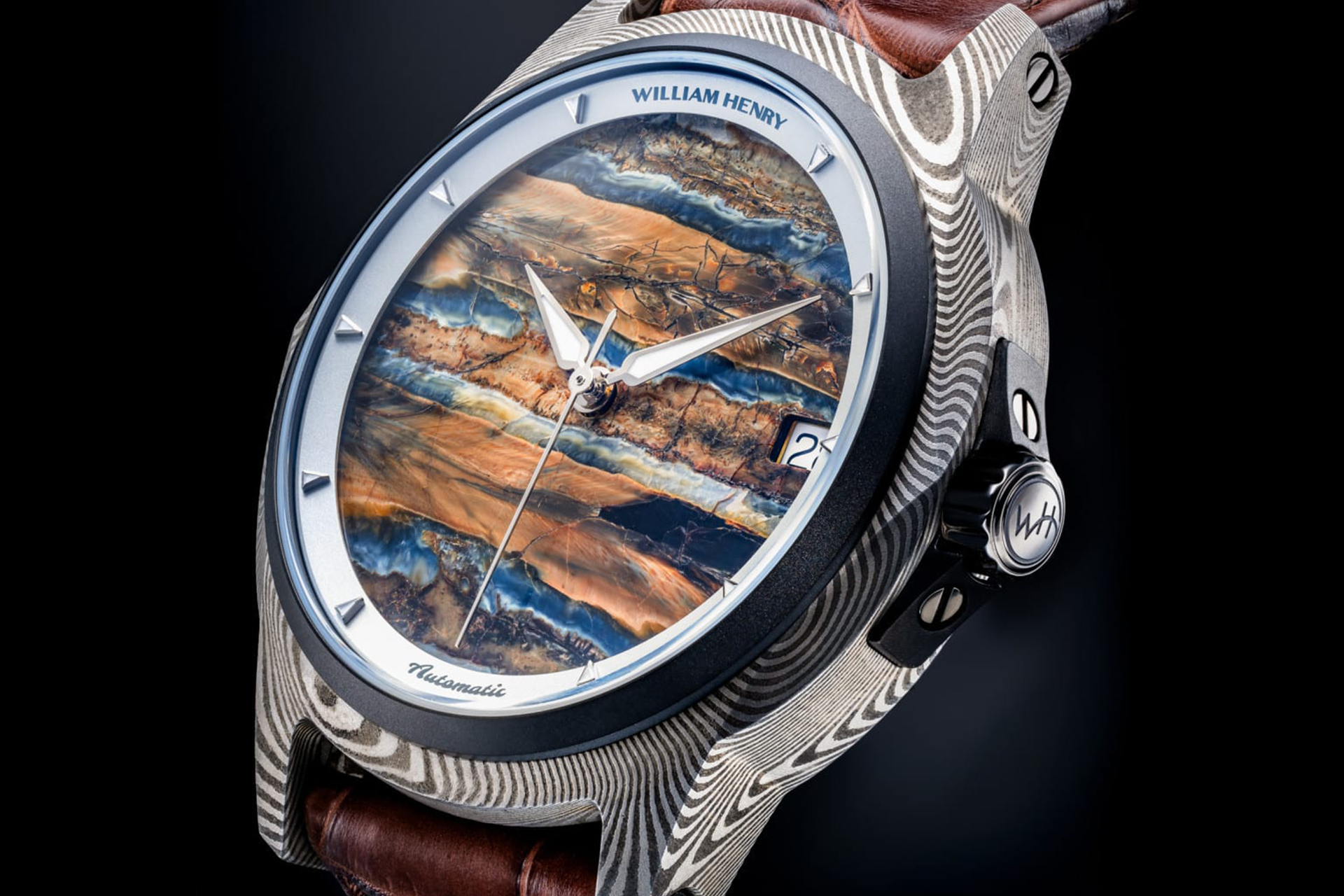 Elegant men's watch with hand made mokume-gane case and mammoth tooth fossil face by william henry