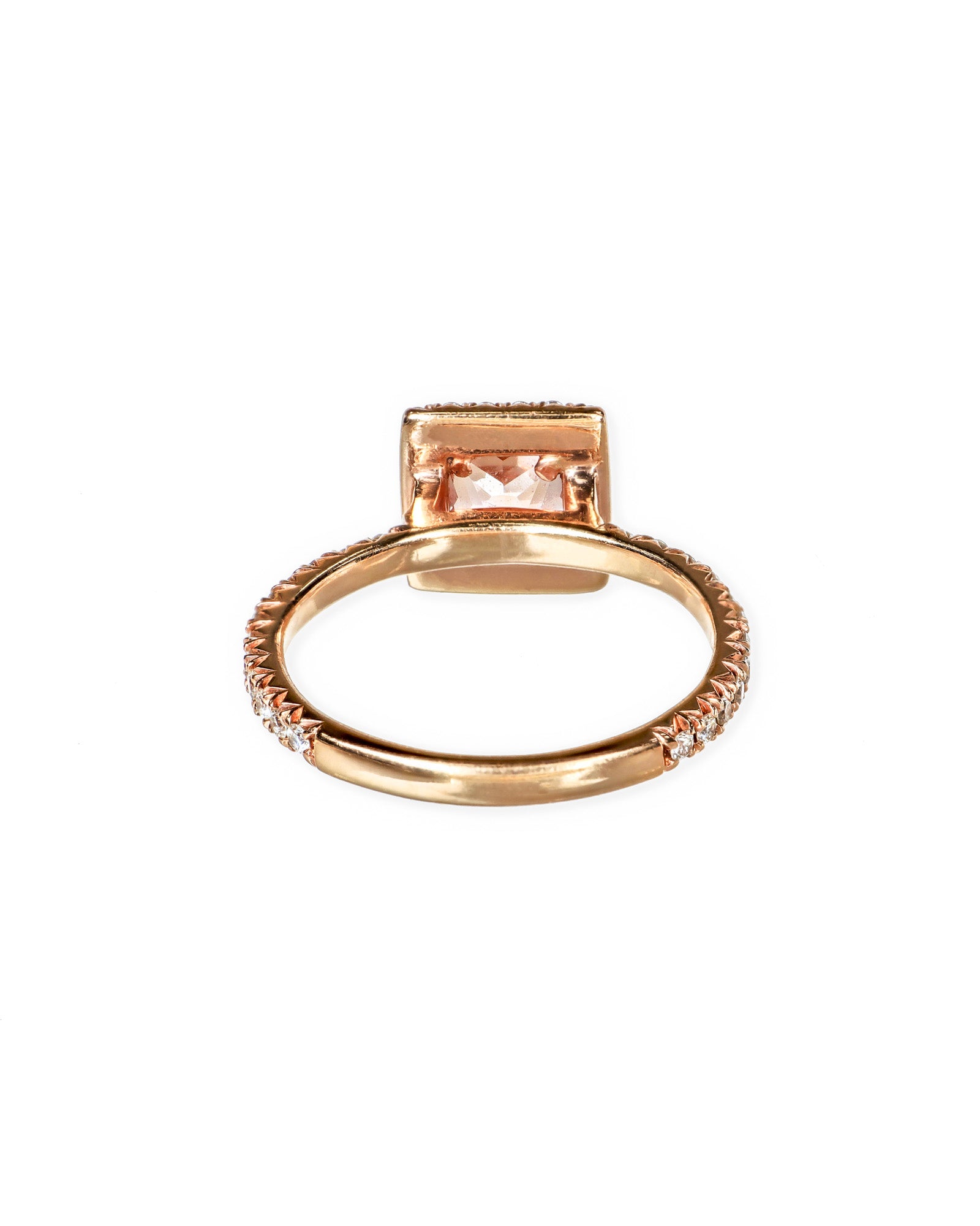 rose gold halo ring with peach sapphire center 