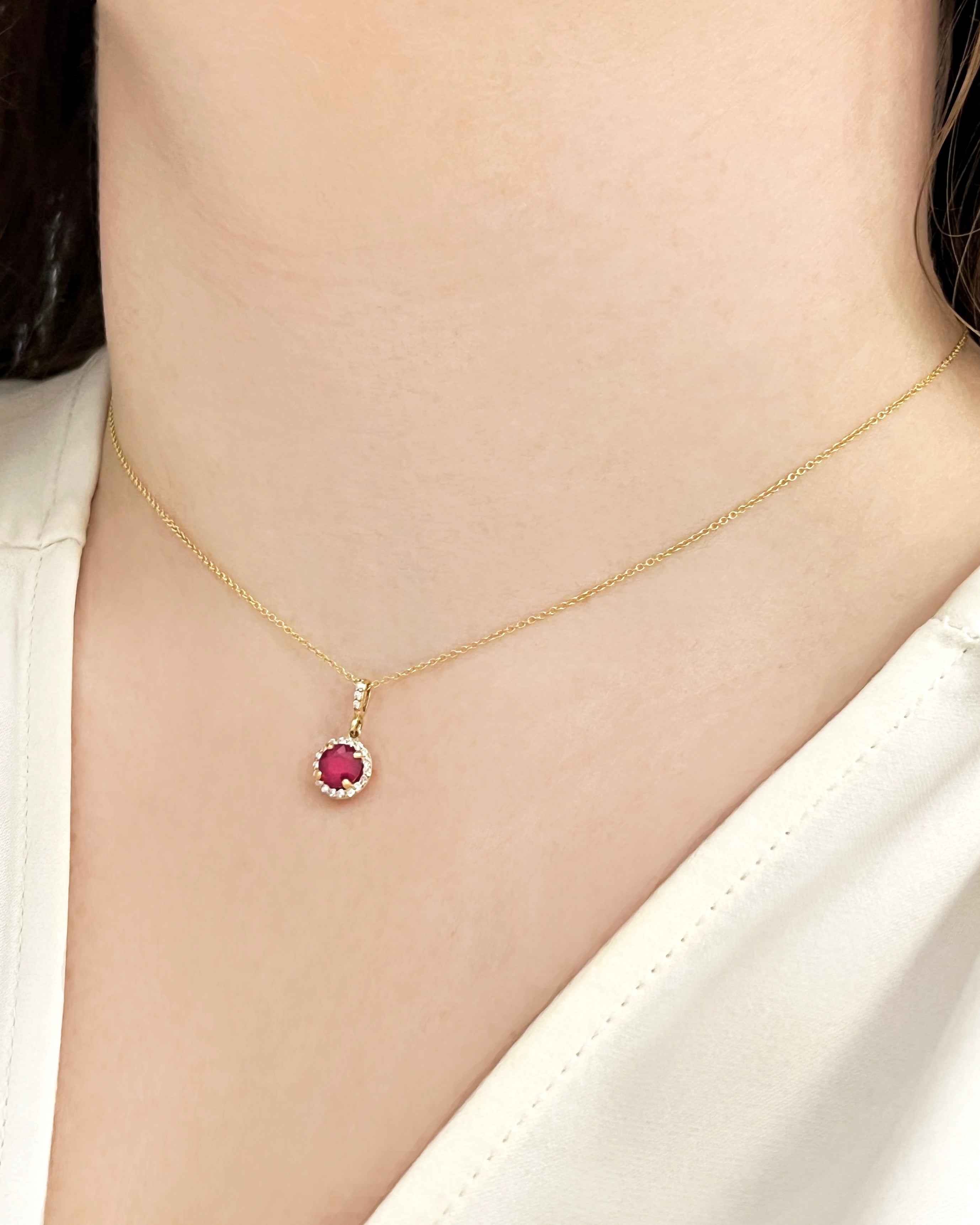 Ruby and diamond halo pendant