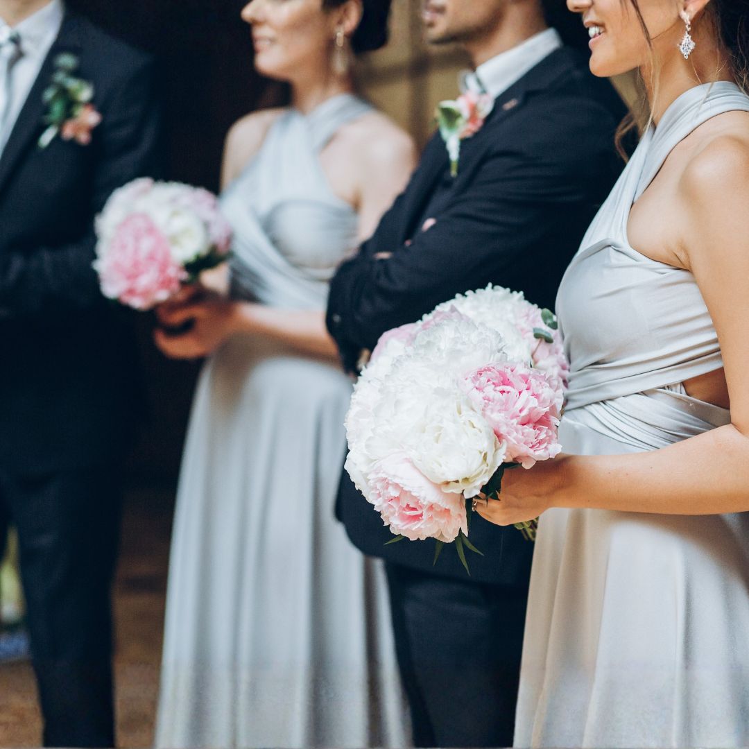 bridesmaid and groomsmen with peony bouquets